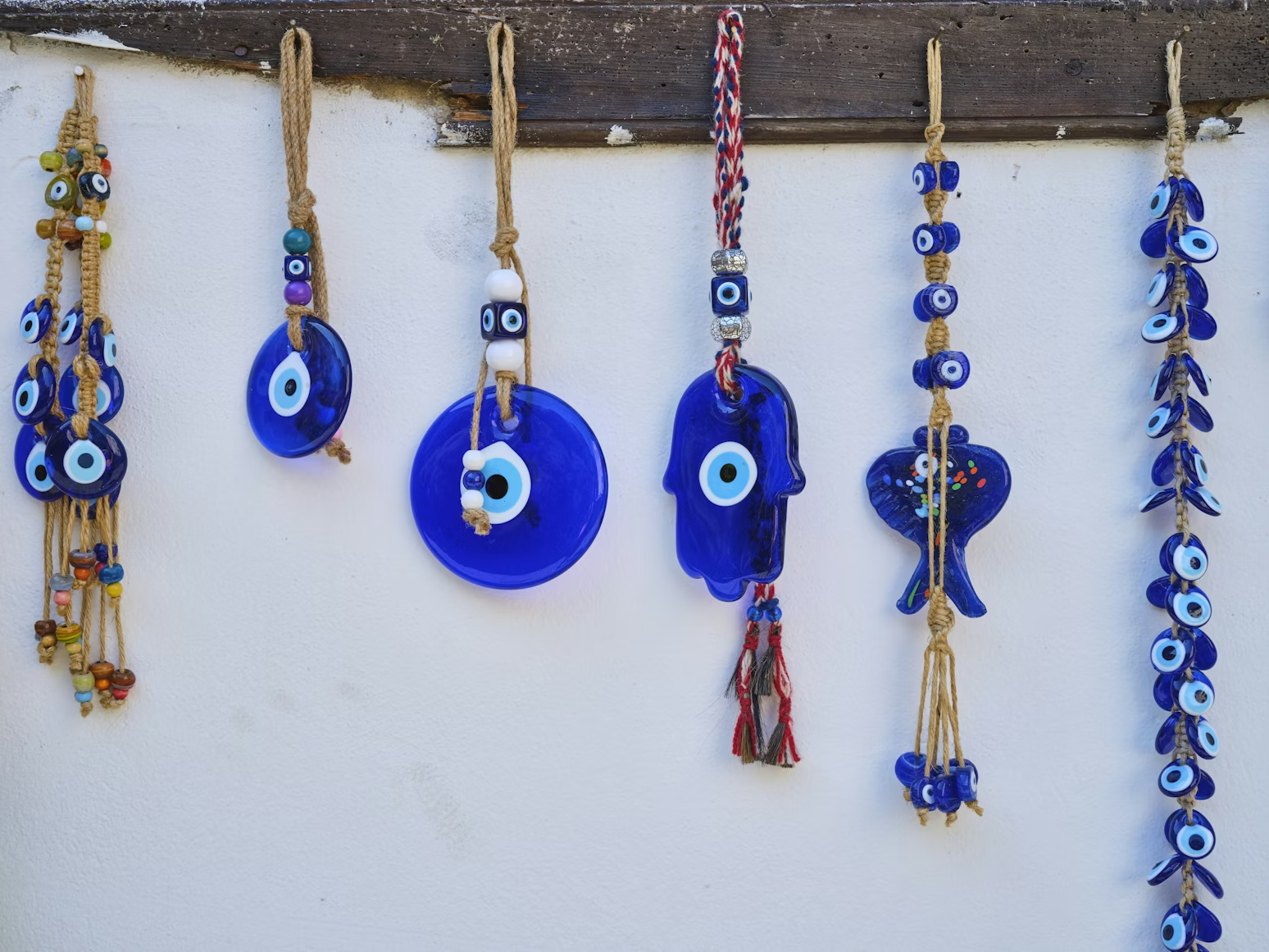 Hand-blown blue glass nazar charms hanging in concentric rings at a Grand Bazaar stall