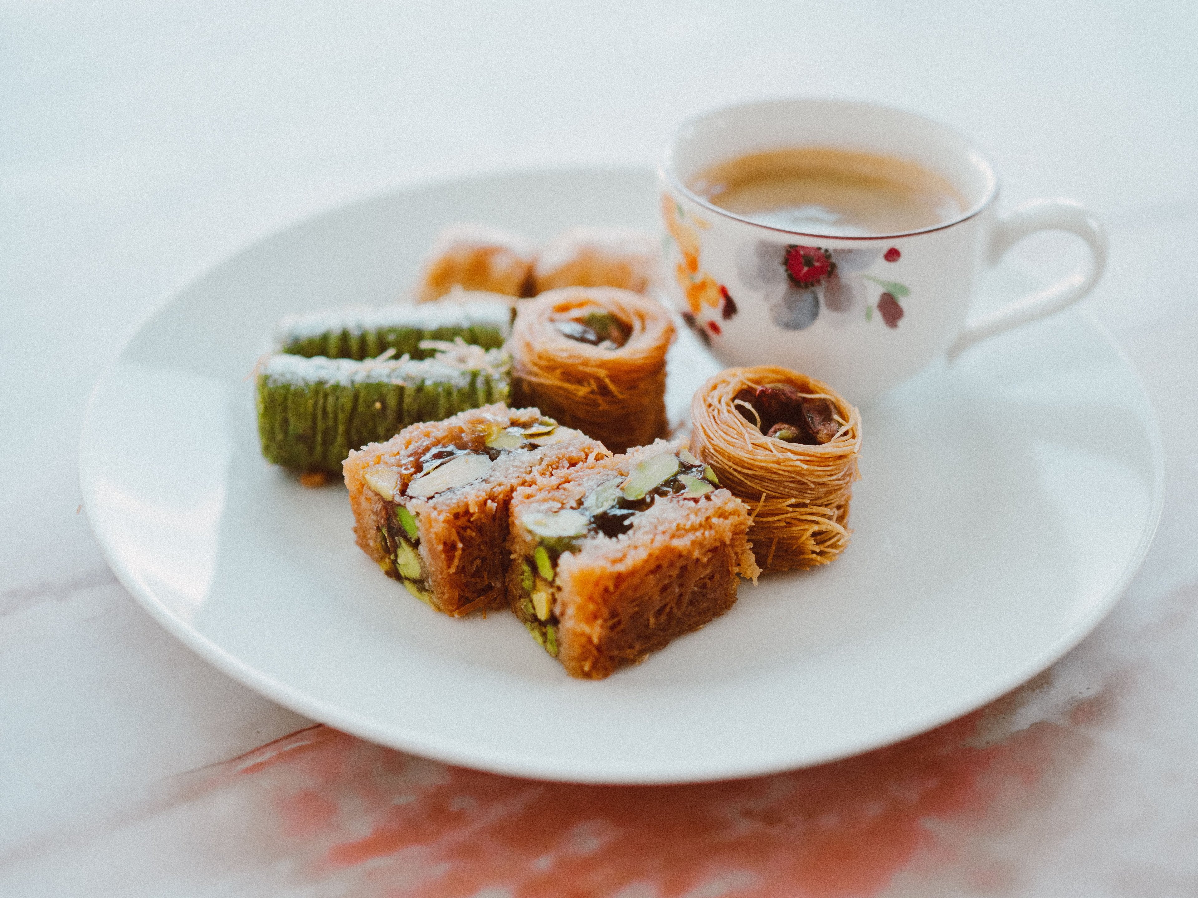 A cup of thick Turkish coffee served with dessert at an Istanbul café
